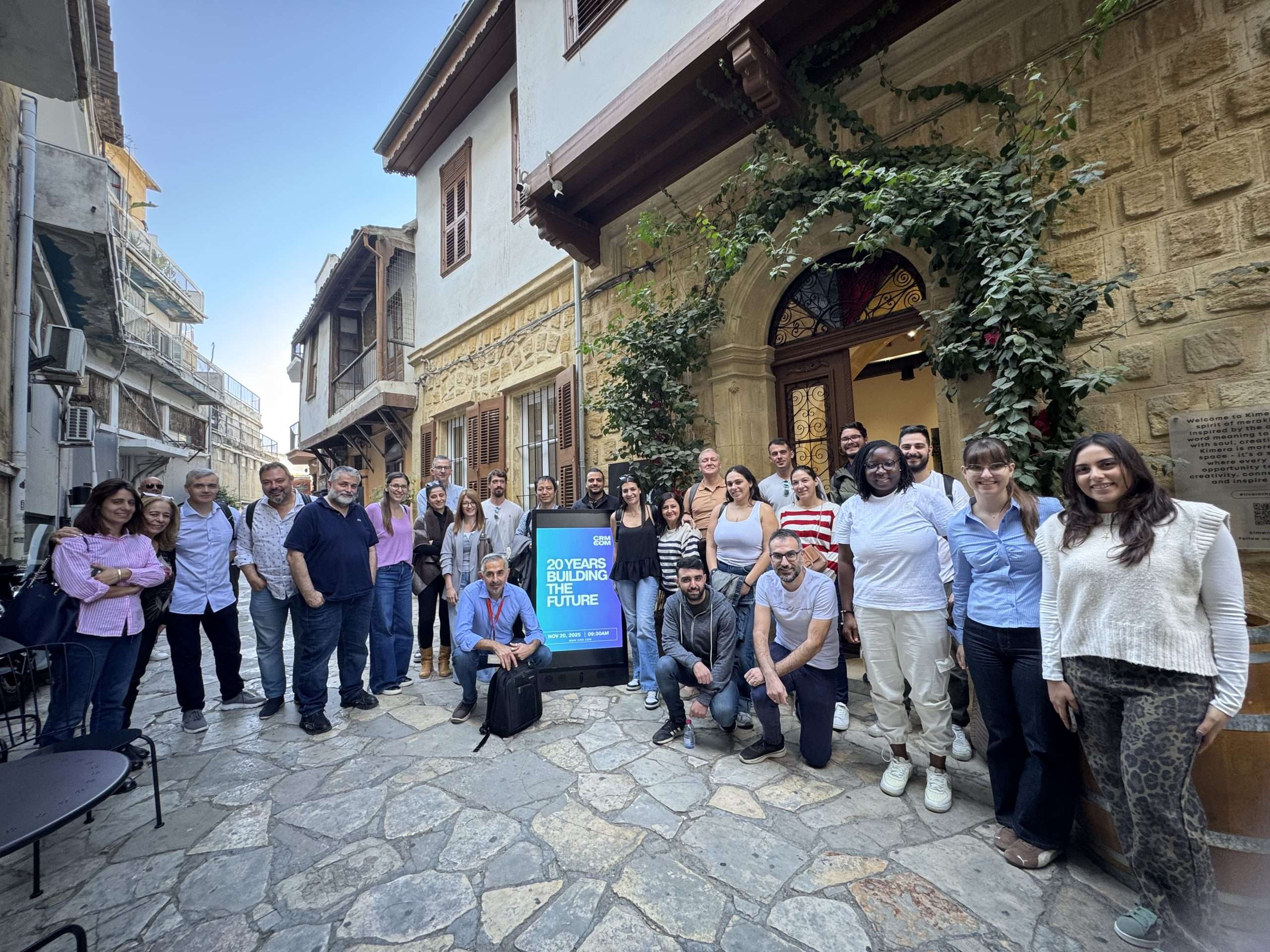 group photo representing crm.com celebrating its twentieth anniversary event