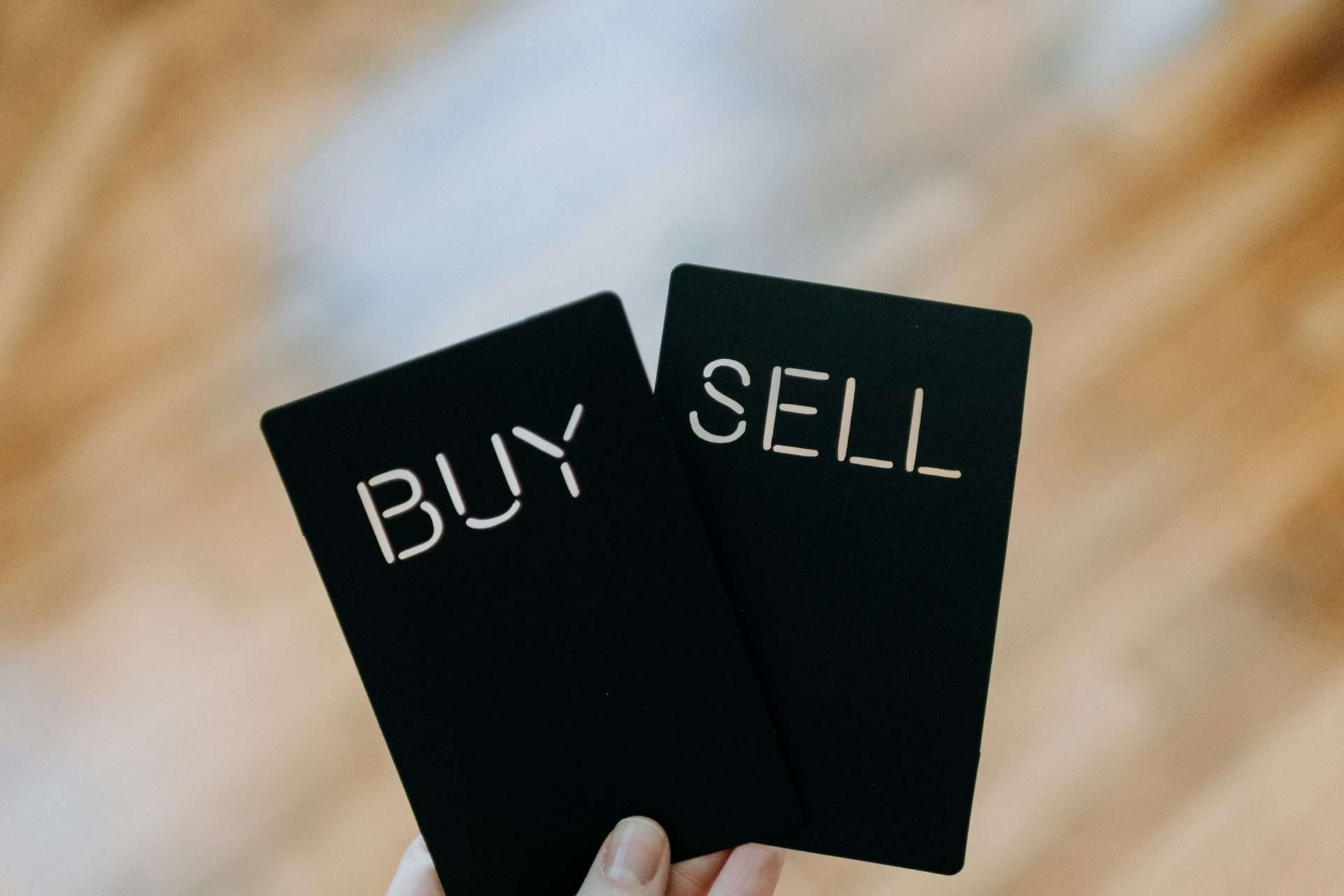 “Buy and sell concept cards representing commercial transactions”